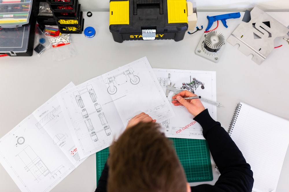 Engineer reviewing technical drawings